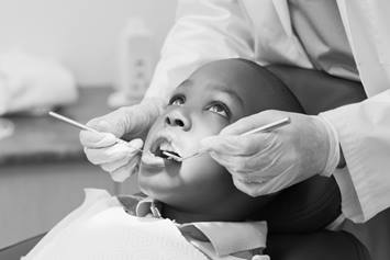 Child undergoing a dental procedure