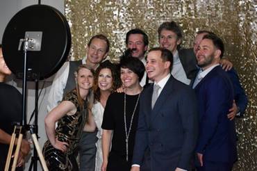 group of people in a photo booth