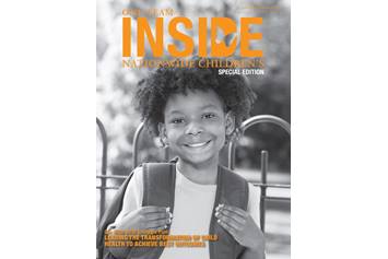 Inside Nationwide Children's - young boy around the age of 10 with his hands on his backpack straps, smiling at the camera.