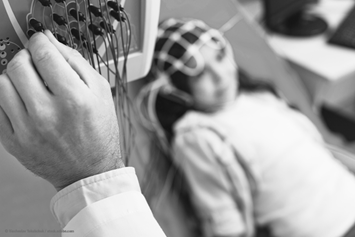 woman connected to a monitor, connected to her head